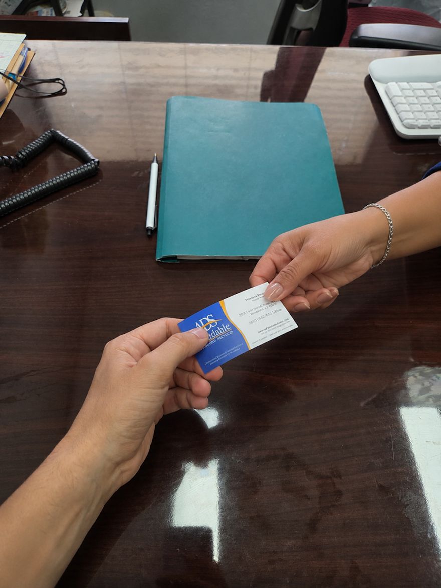 Handing a client an ADS business card